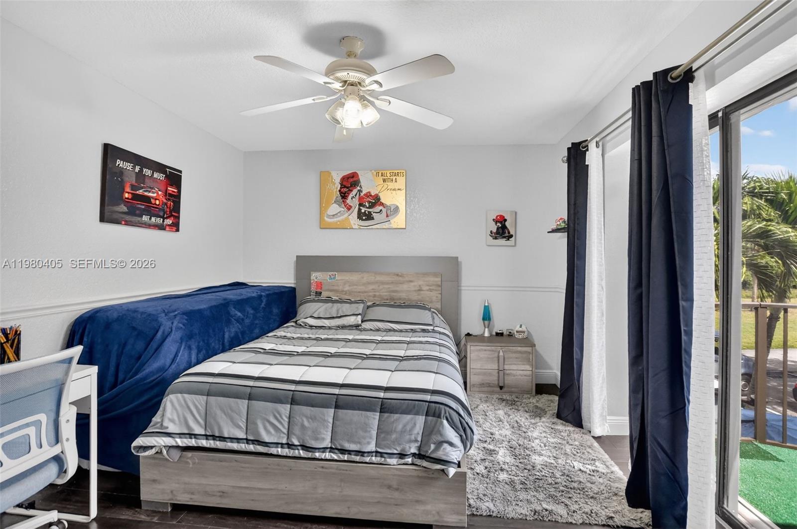 8181 Boca Rio Drive, Unit 8181 Boca Raton, FL 33433 - Photo 24 of 40 a bedroom with bed and a window