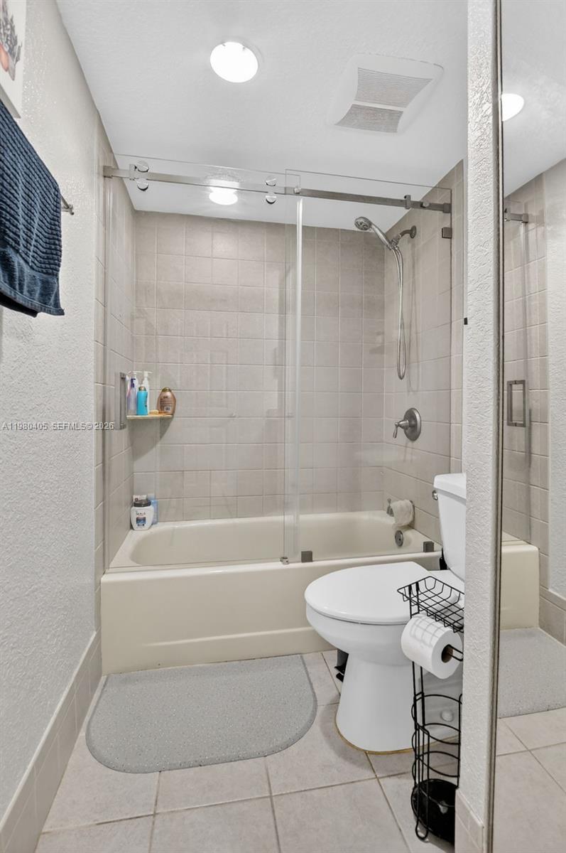 8181 Boca Rio Drive, Unit 8181 Boca Raton, FL 33433 - Photo 28 of 40 a bathroom with a sink toilet and shower
