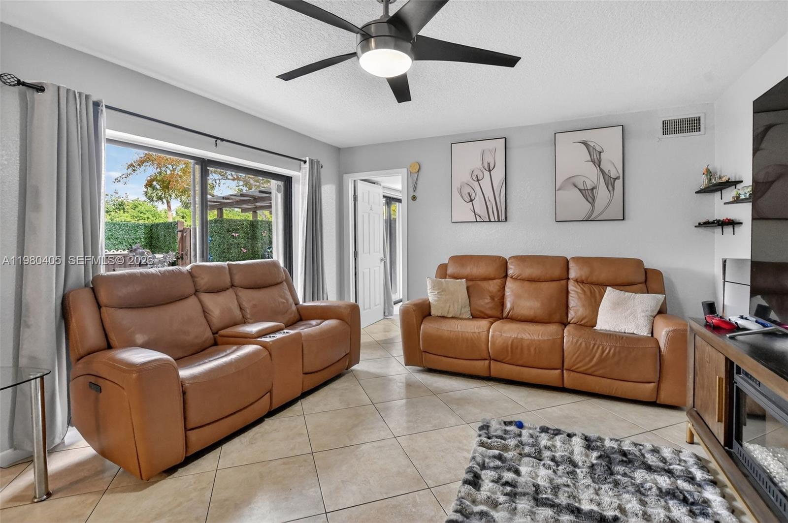 8181 Boca Rio Drive, Unit 8181 Boca Raton, FL 33433 - Photo 3 of 40 a living room with furniture and a large window