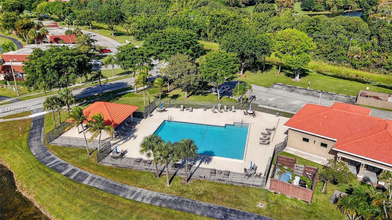 8181 Boca Rio Drive, Unit 8181 Boca Raton, FL 33433 - Photo 35 of 40 an aerial view of a house with a garden and trees