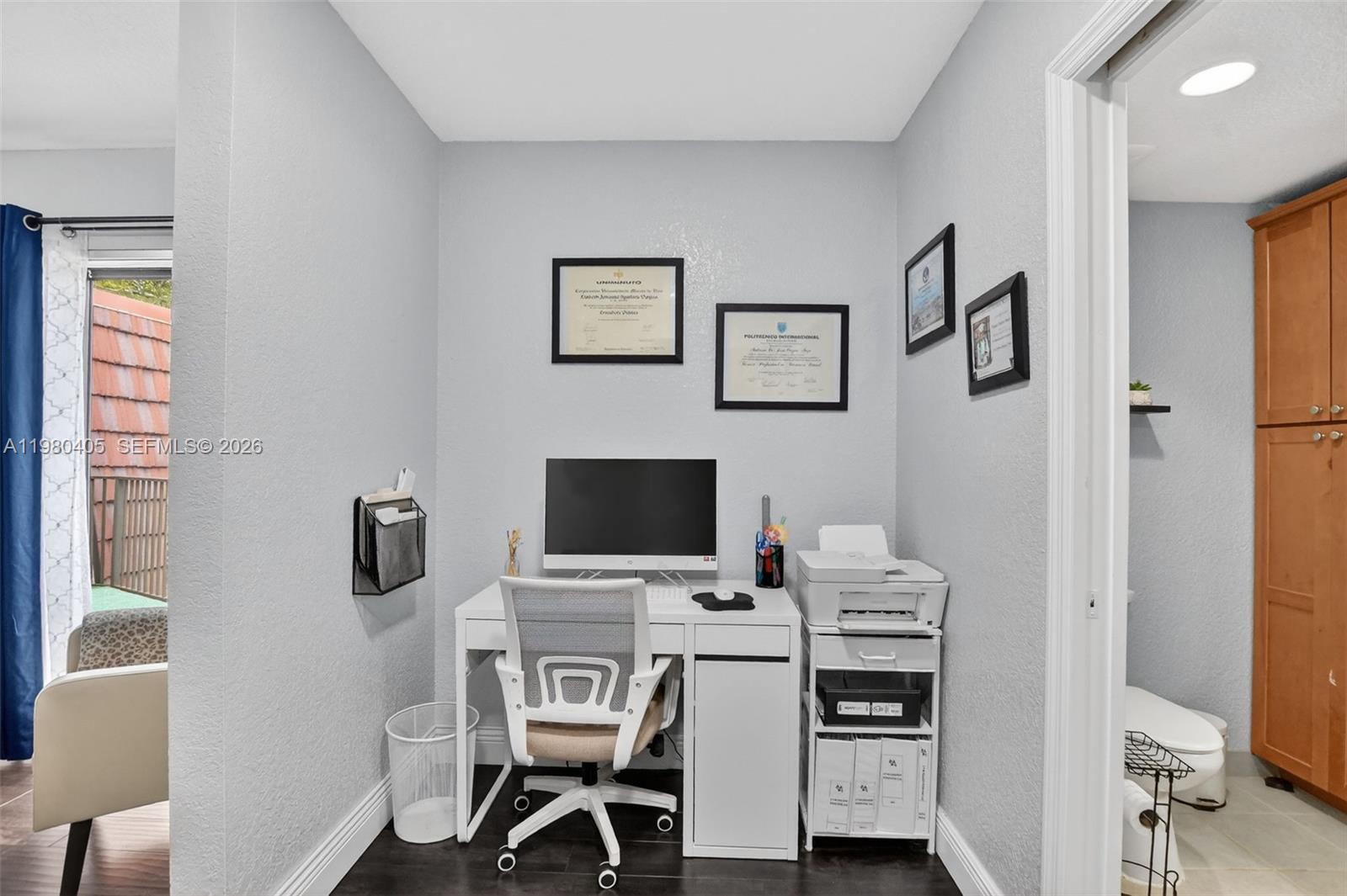 8181 Boca Rio Drive, Unit 8181 Boca Raton, FL 33433 - Photo 5 of 40 a view of a workspace with furniture and a window