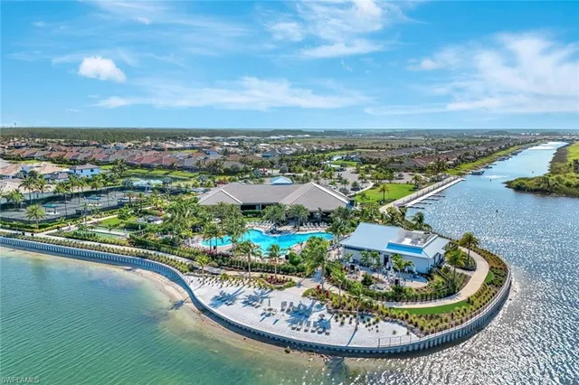 a view of a swimming pool with an outdoor seating