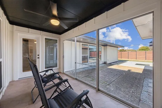 a patio with table and chairs