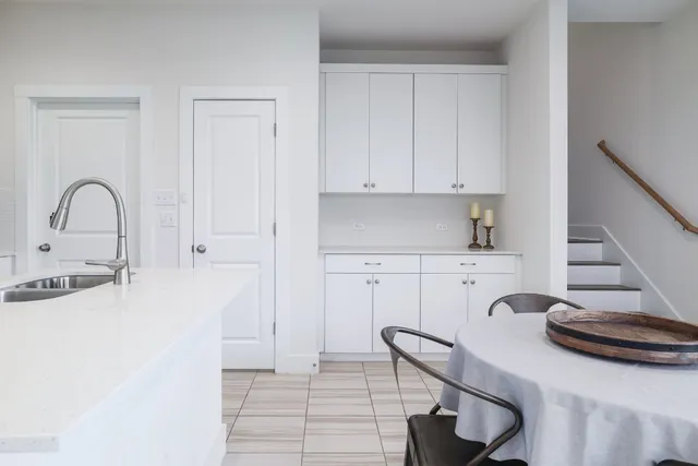 a kitchen with stainless steel appliances granite countertop a stove a refrigerator and a sink