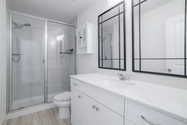 a bedroom with a large bed and a flat screen tv