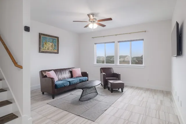 a kitchen with a sink a stove and chairs