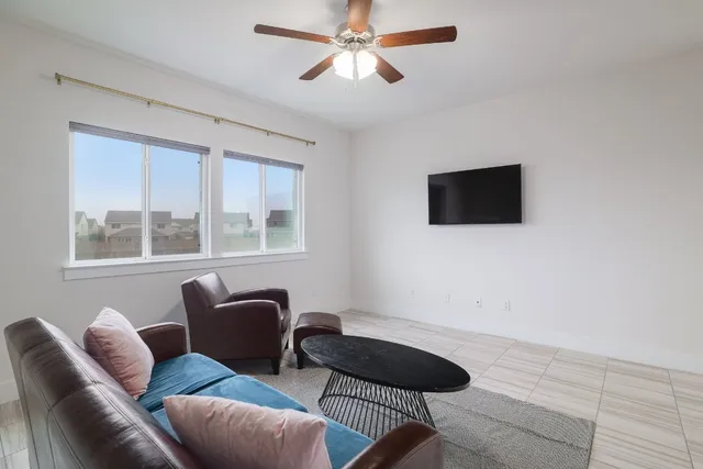 a living room with furniture and a window