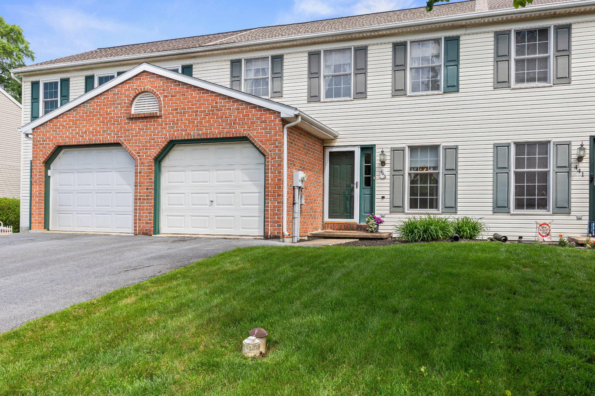 443 Crosswinds Drive Lititz, PA 17543 - Photo 1 of 26 a front view of a house with a yard and garage