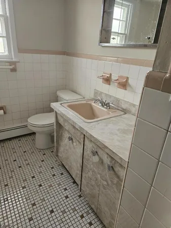 a bathroom with a sink and a toilet