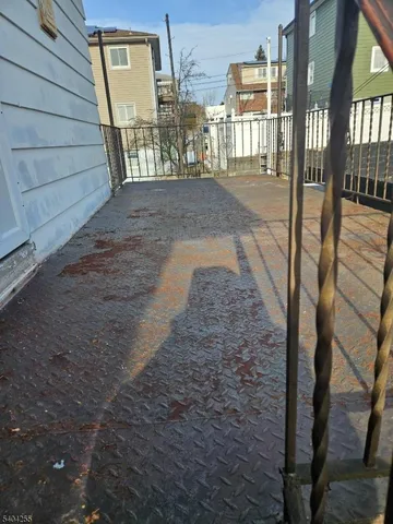 a view of a porch with wooden floor