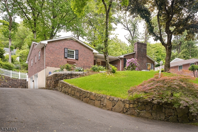 106 Division Avenue Summit, NJ 07901 - Photo 38 of 38 a house with trees in the background