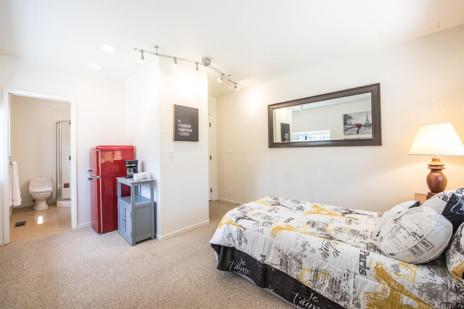 15046 Leiter Way Grass Valley, CA 95949 - Photo 19 of 43 a bedroom with bed and a chandelier