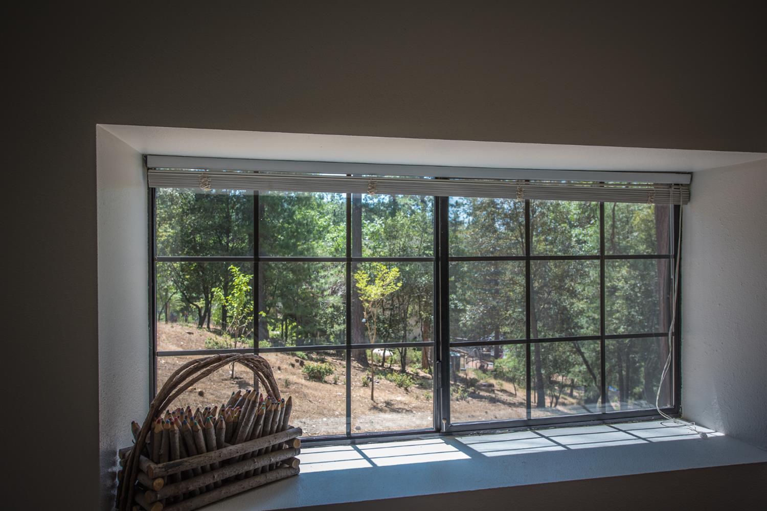 15046 Leiter Way Grass Valley, CA 95949 - Photo 20 of 43 a view of a bedroom with a balcony