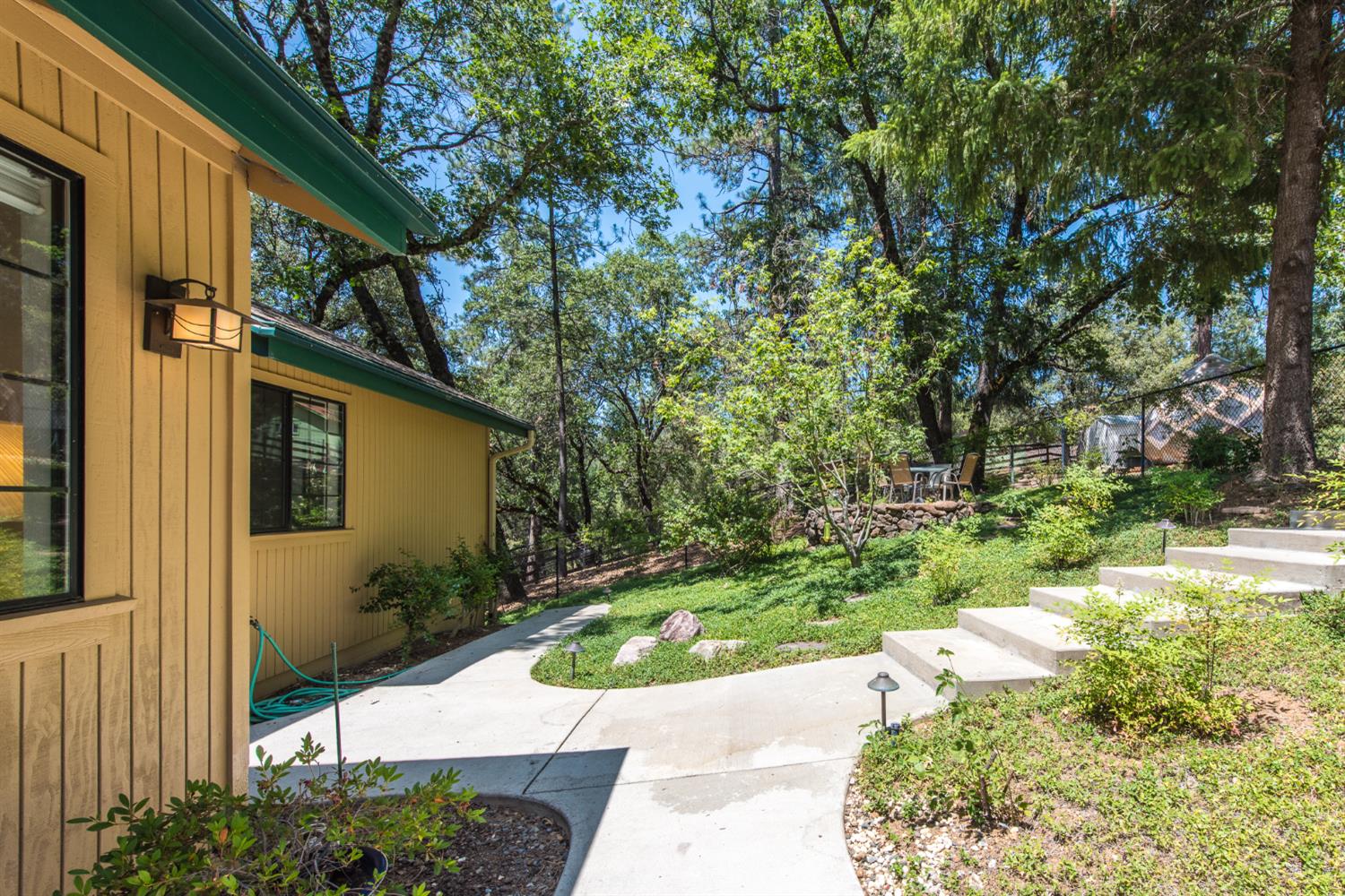 15046 Leiter Way Grass Valley, CA 95949 - Photo 2 of 43 a view of a backyard with potted plants