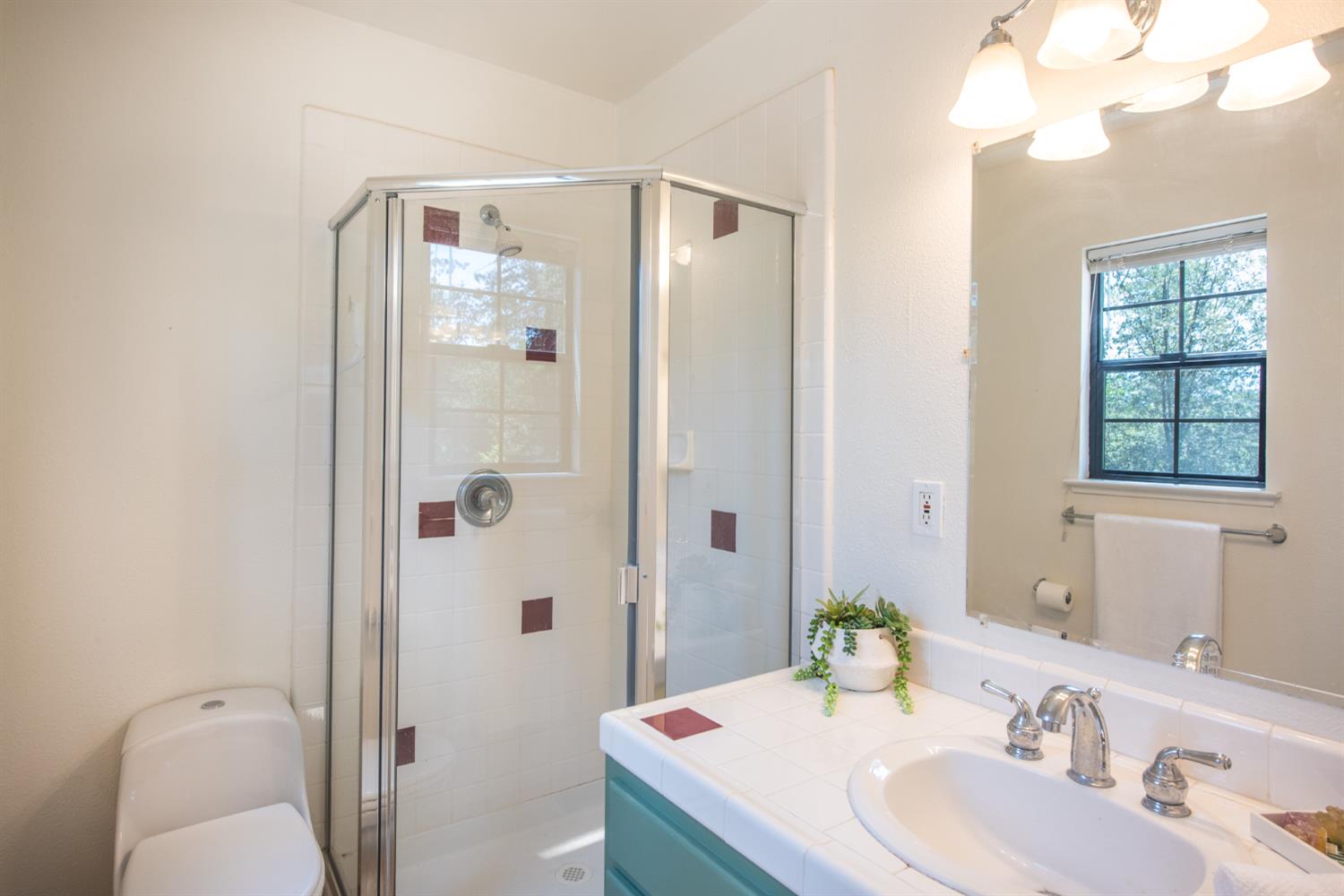 15046 Leiter Way Grass Valley, CA 95949 - Photo 21 of 43 a bathroom with a sink toilet and shower