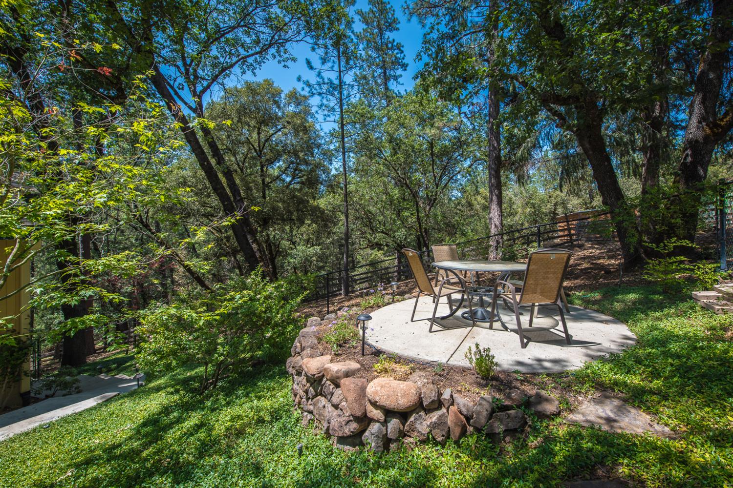 15046 Leiter Way Grass Valley, CA 95949 - Photo 3 of 43 a view of a chairs and table in backyard