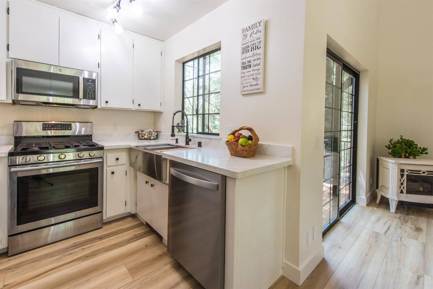 15046 Leiter Way Grass Valley, CA 95949 - Photo 10 of 43 a kitchen with a sink stove and microwave