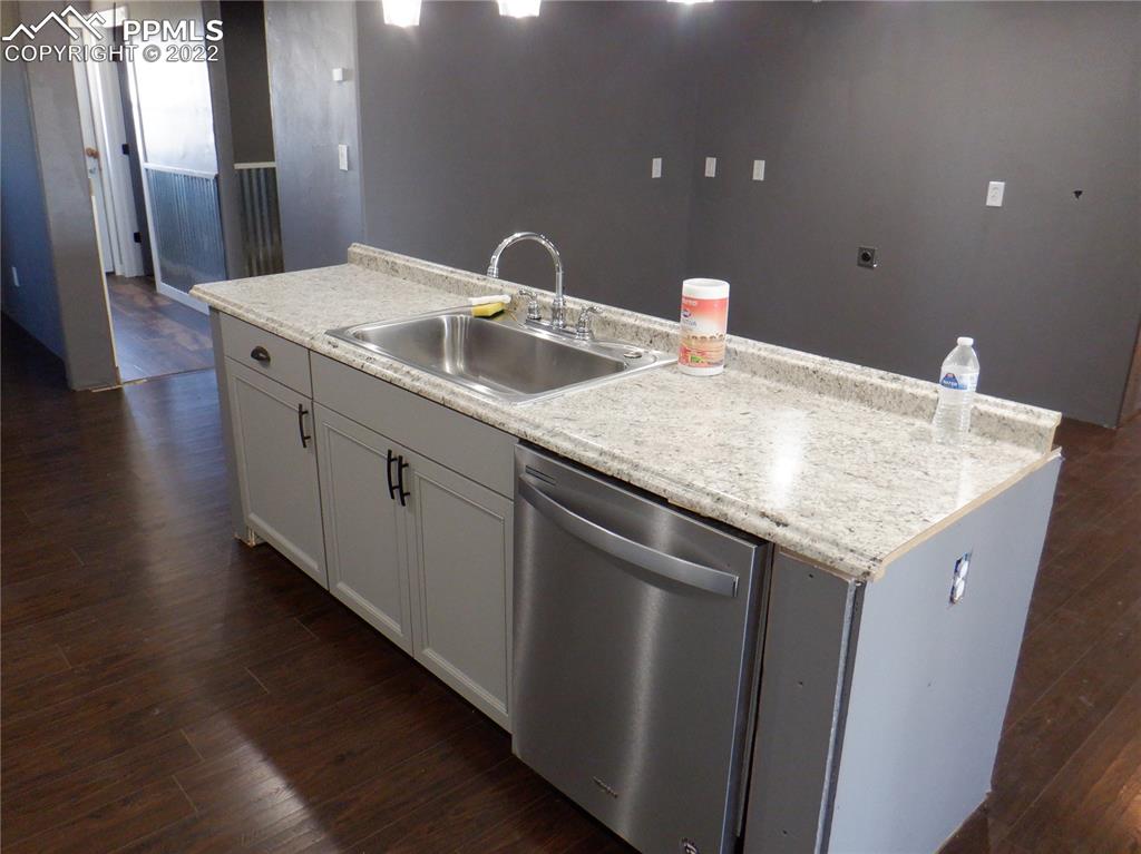 995 Choate Lane Yoder, CO 80864 - Photo 14 of 48 a bathroom with a granite countertop sink and a mirror