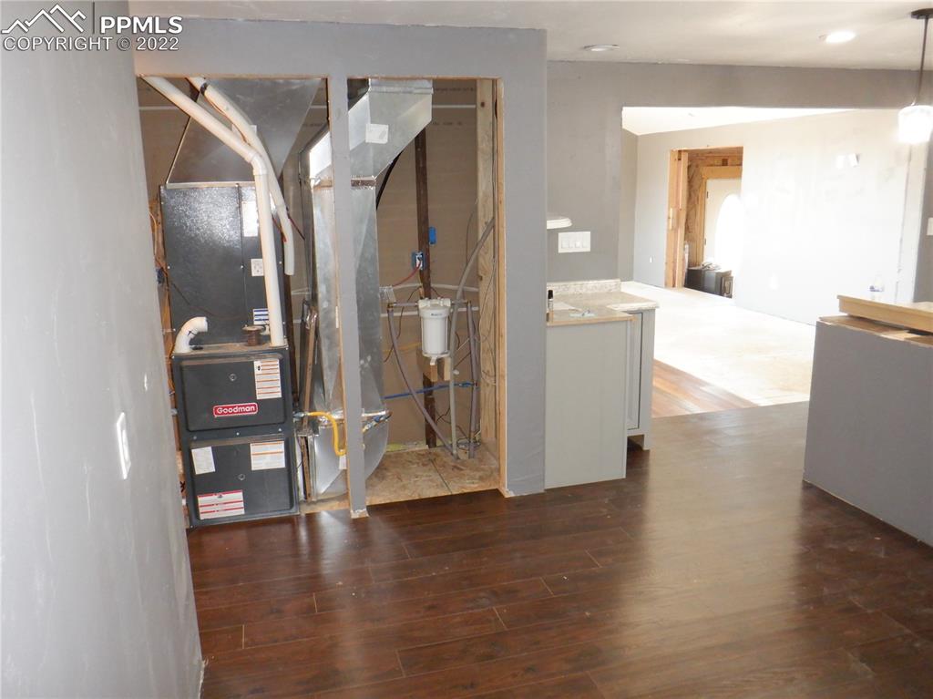 995 Choate Lane Yoder, CO 80864 - Photo 17 of 48 a view of a kitchen cabinets and wooden floor