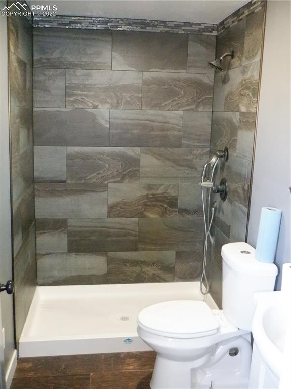 995 Choate Lane Yoder, CO 80864 - Photo 21 of 48 a bathroom with a toilet and a shower
