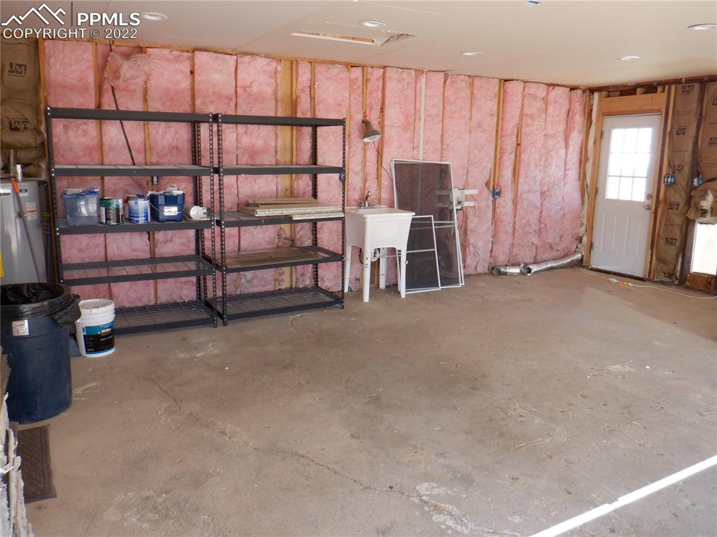 995 Choate Lane Yoder, CO 80864 - Photo 28 of 48 a view of a livingroom with furniture and staircase