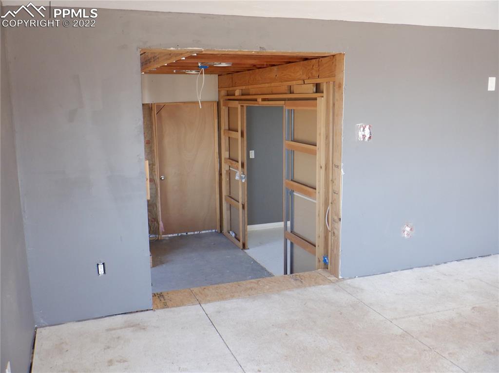 995 Choate Lane Yoder, CO 80864 - Photo 37 of 48 an empty room with closet and wooden floor