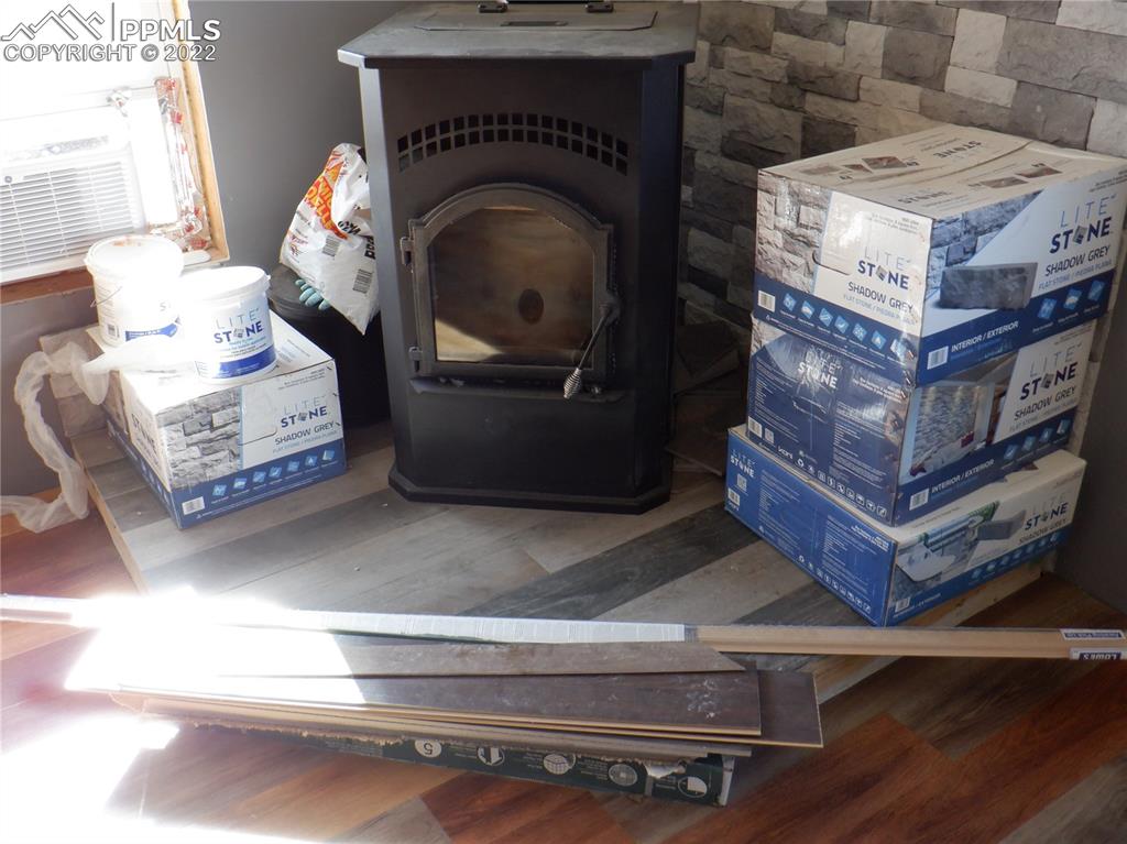 995 Choate Lane Yoder, CO 80864 - Photo 46 of 48 a living room with furniture and a fireplace