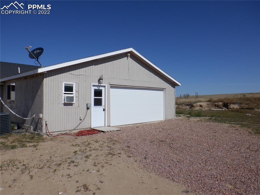 995 Choate Lane Yoder, CO 80864 - Photo 7 of 48 a view of a house with backyard