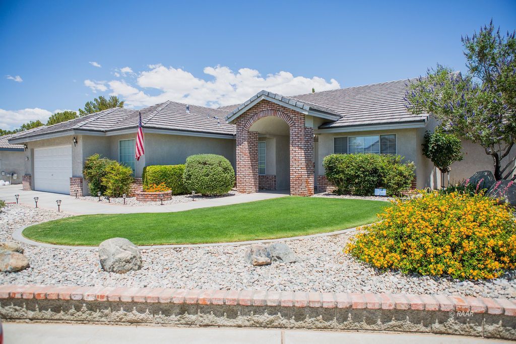 912 Beverly Court Ridgecrest, CA 93555 - Photo 1 of 1 a view of a house with a garden