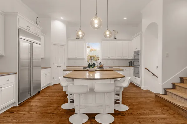 a view of kitchen with dining table and chairs