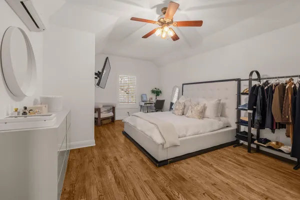 a bed room with a bed and a chandelier