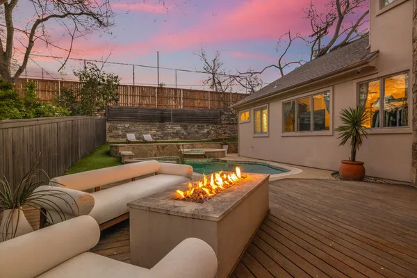a view of a patio with couches and pool