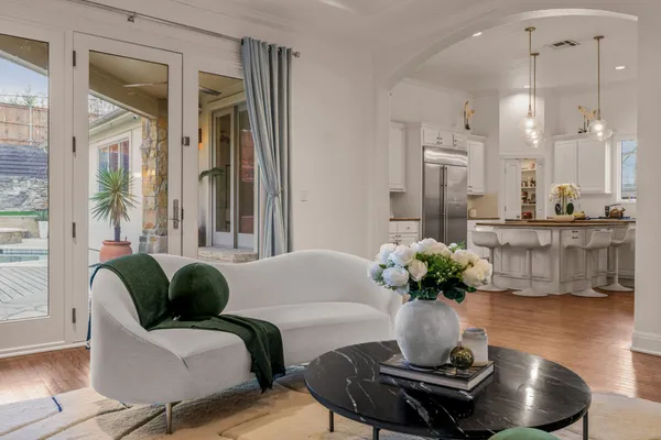a living room with furniture and a potted plant