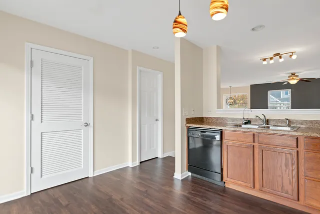 a kitchen with stainless steel appliances granite countertop a stove and a refrigerator