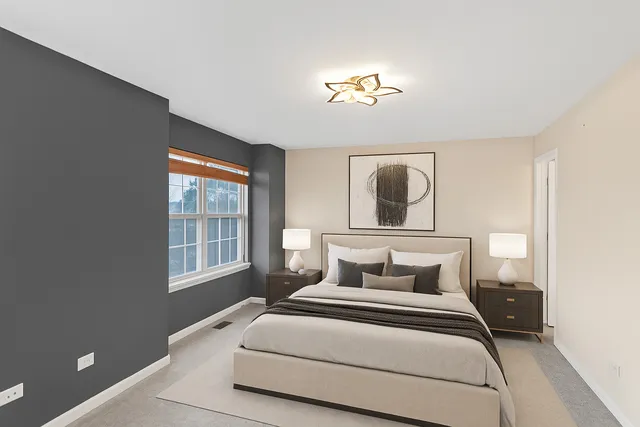 a bedroom with a large bed and a window