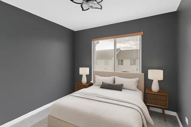 a bedroom with bed and window