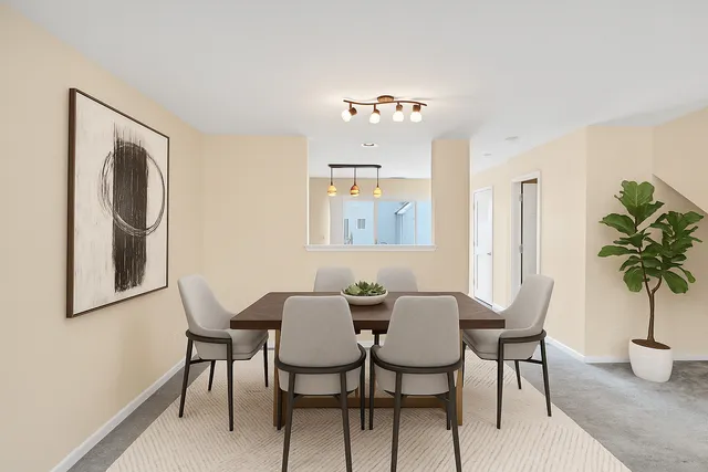 a view of a dining room with furniture and window