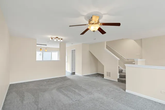 a view of a livingroom with a ceiling fan