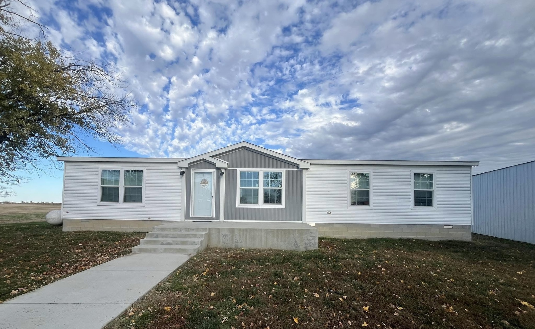 front view of a house with a yard