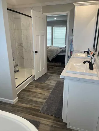 a en suite bathroom with a sink and a mirror