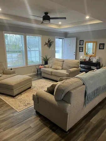 a living room with furniture and a large window