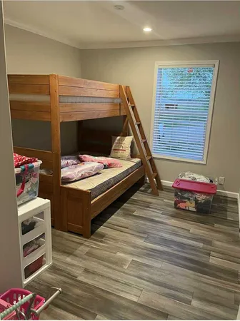 a bedroom with a bed and a dresser