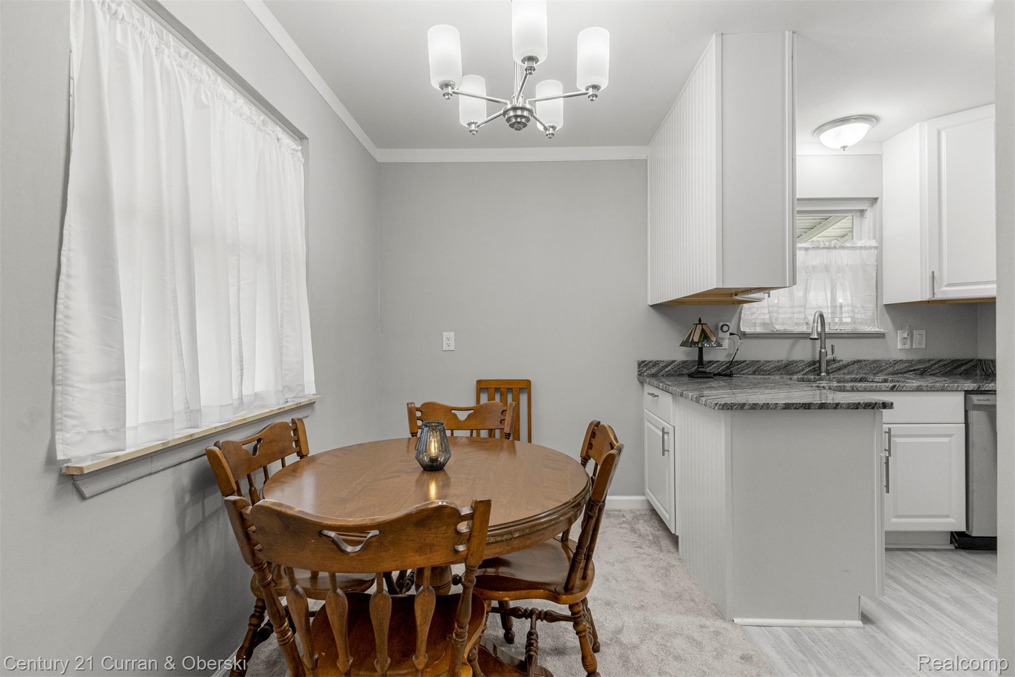 7120 Jackson Street Taylor, MI 48180 - Photo 14 of 24 Dining room with a chandelier and crown molding