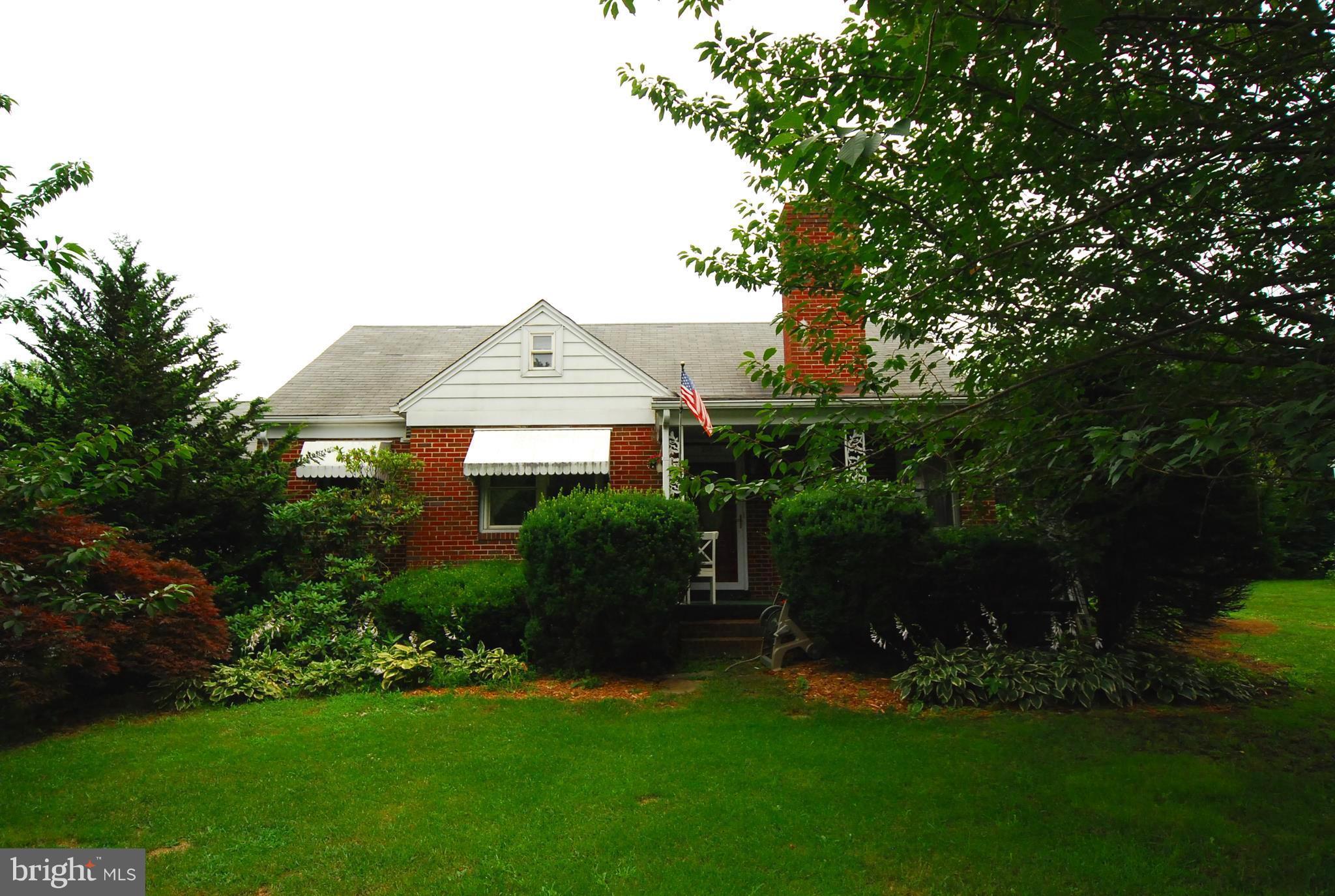 26609 Ridge Road Damascus, MD 20872 - Photo 2 of 17 a front view of house with yard and green space