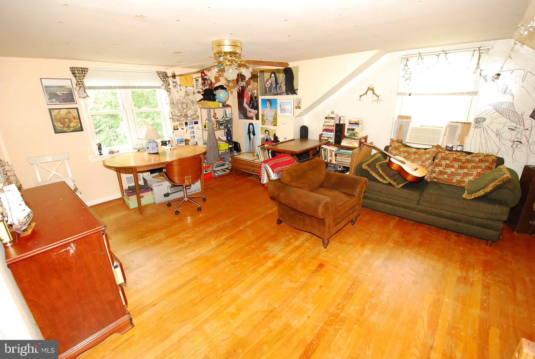 26609 Ridge Road Damascus, MD 20872 - Photo 14 of 17 a living room with furniture and a large window
