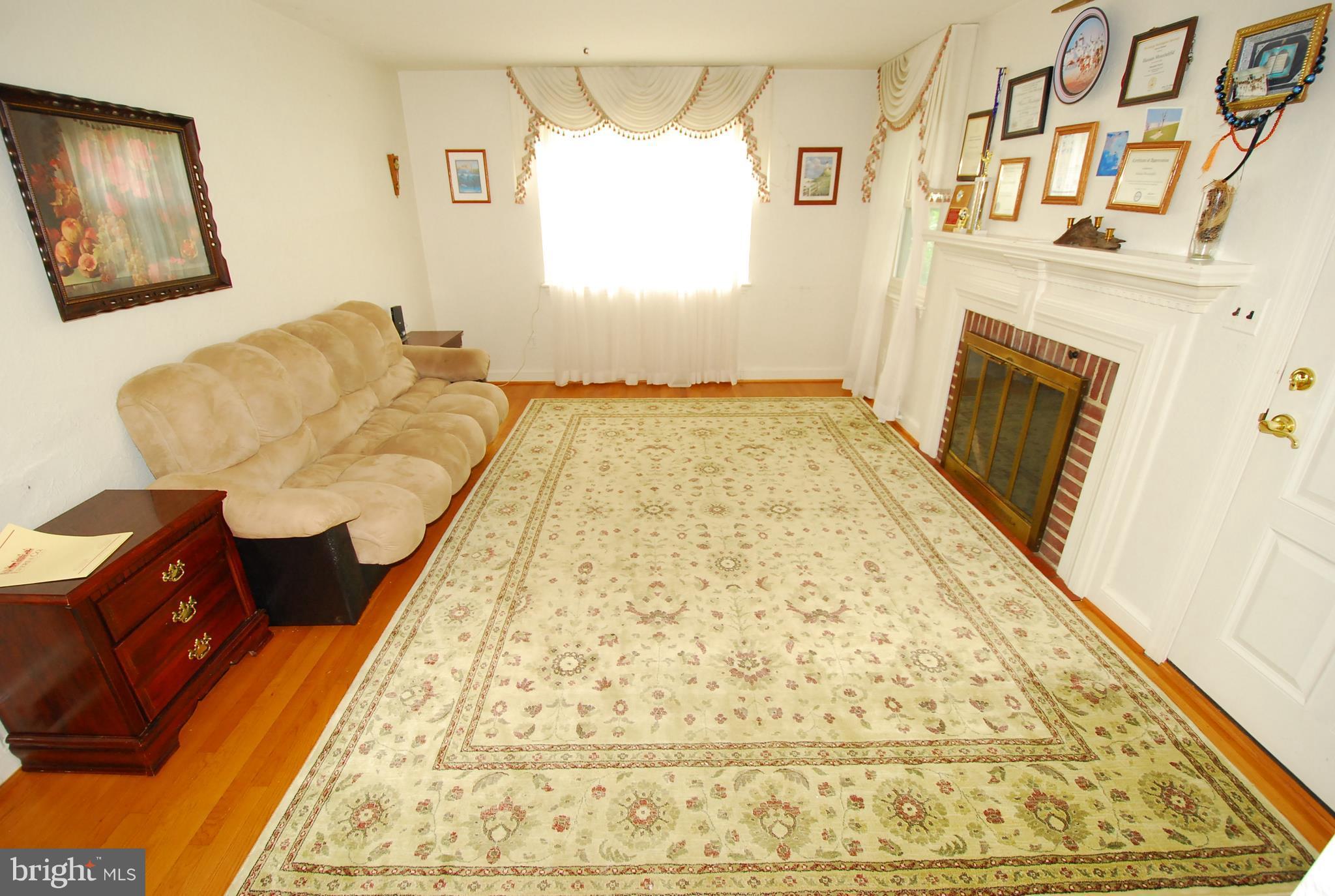 26609 Ridge Road Damascus, MD 20872 - Photo 10 of 17 a bedroom with a bed and a window