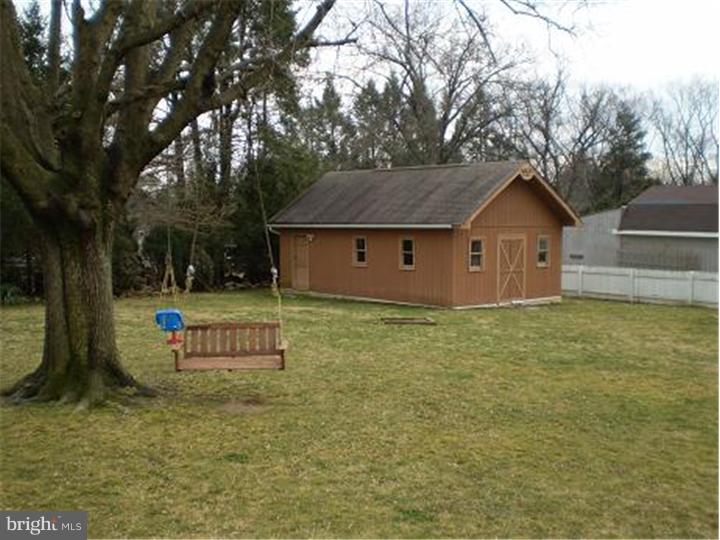 9125 Verree Road Philadelphia, PA 19115 - Photo 22 of 25 a front view of a house with a garden and yard