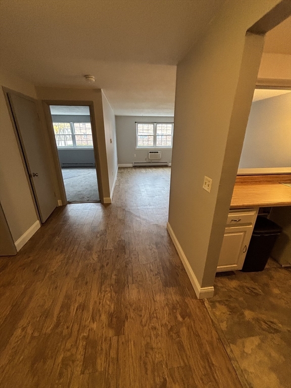 43 Berlin Street, Unit 411 Clinton, MA 01510 - Photo 6 of 14 a view of entryway with window and wooden floor