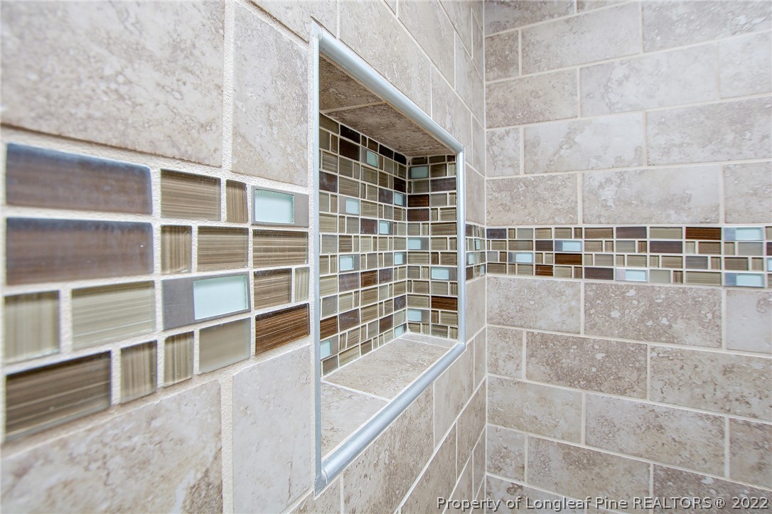 246 Loop Road Raeford, NC 28376 - Photo 21 of 42 a bathroom with a bathtub