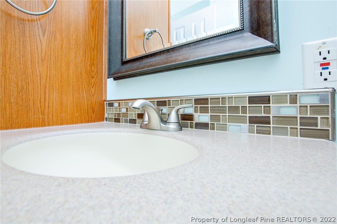 246 Loop Road Raeford, NC 28376 - Photo 22 of 42 a view of a swimming pool and window